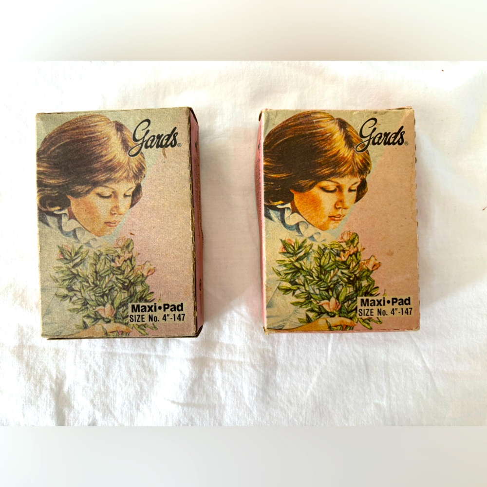 Two vintage antique boxes of maxi pads. One per box.